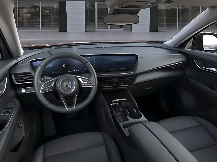 Wide view of the 2025 Buick Envision interior with a curved digital display, leather seats, and premium console layout